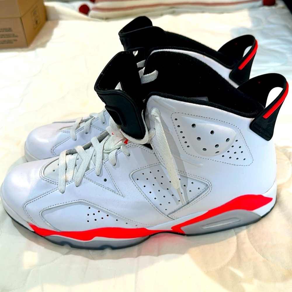 NIKE Air Jordan men’s 13.  White high tops with orange trim.  Gently worn